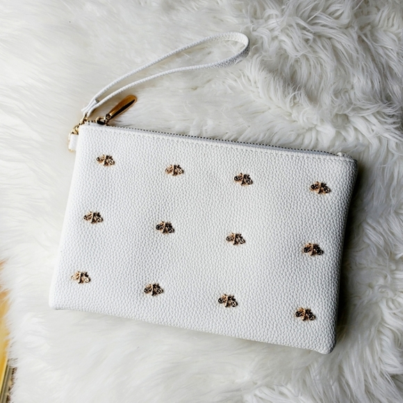 Sondra Roberts Handbags - Sondra Roberts wristlet, white with golden 🐝 bee's